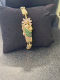St June with gold and green bracelet