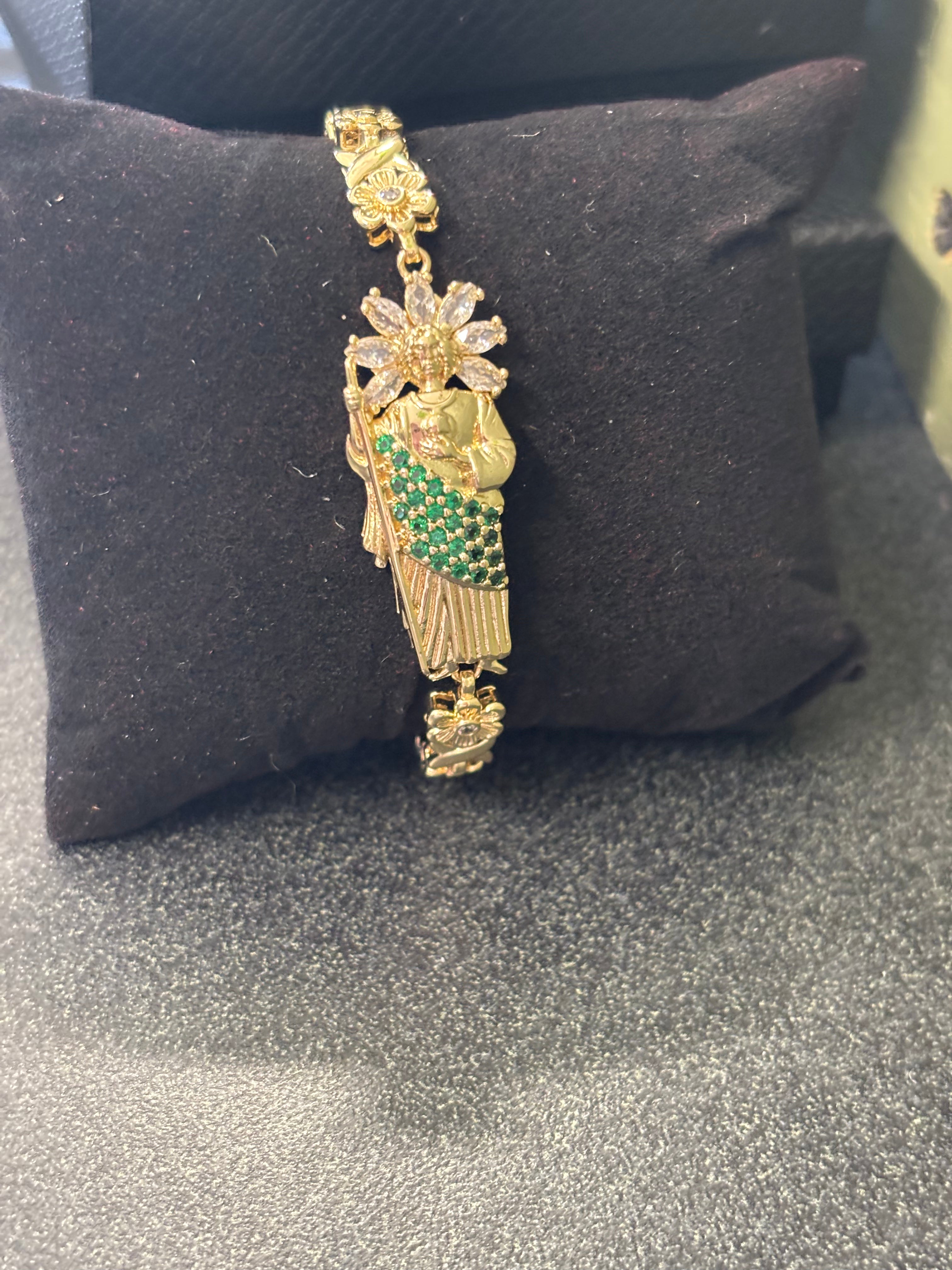 St June with gold and green bracelet